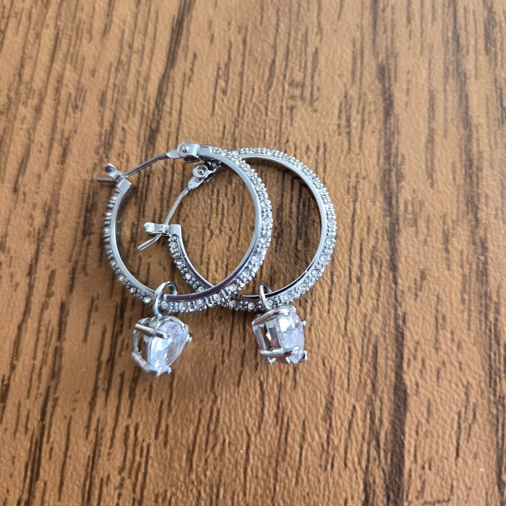 Juicy Couture silver color hoop with cubic zirconia.